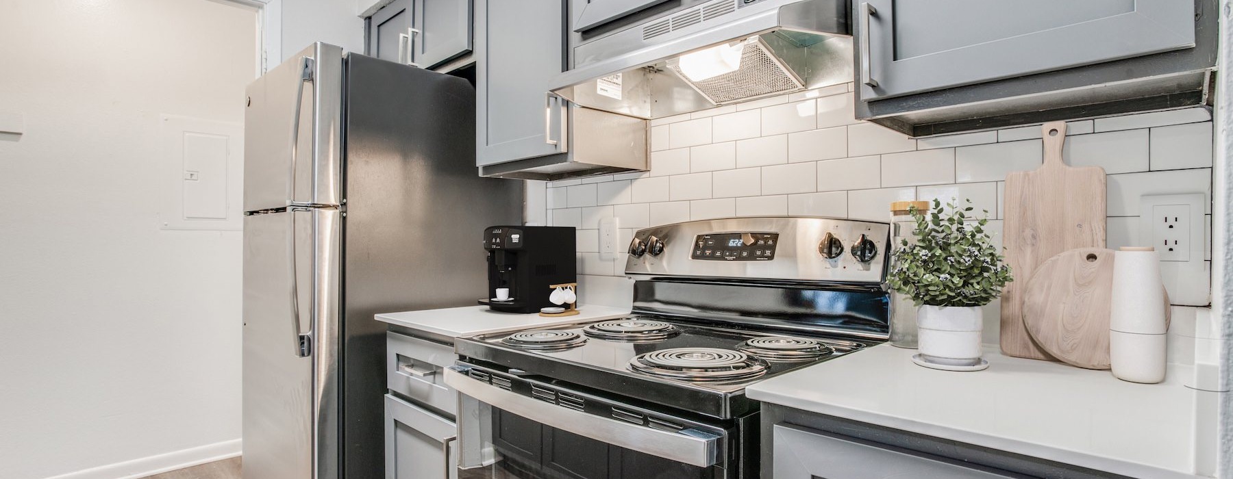a kitchen with white cabinets