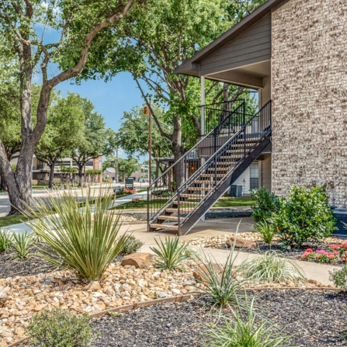 a garden in front of a building