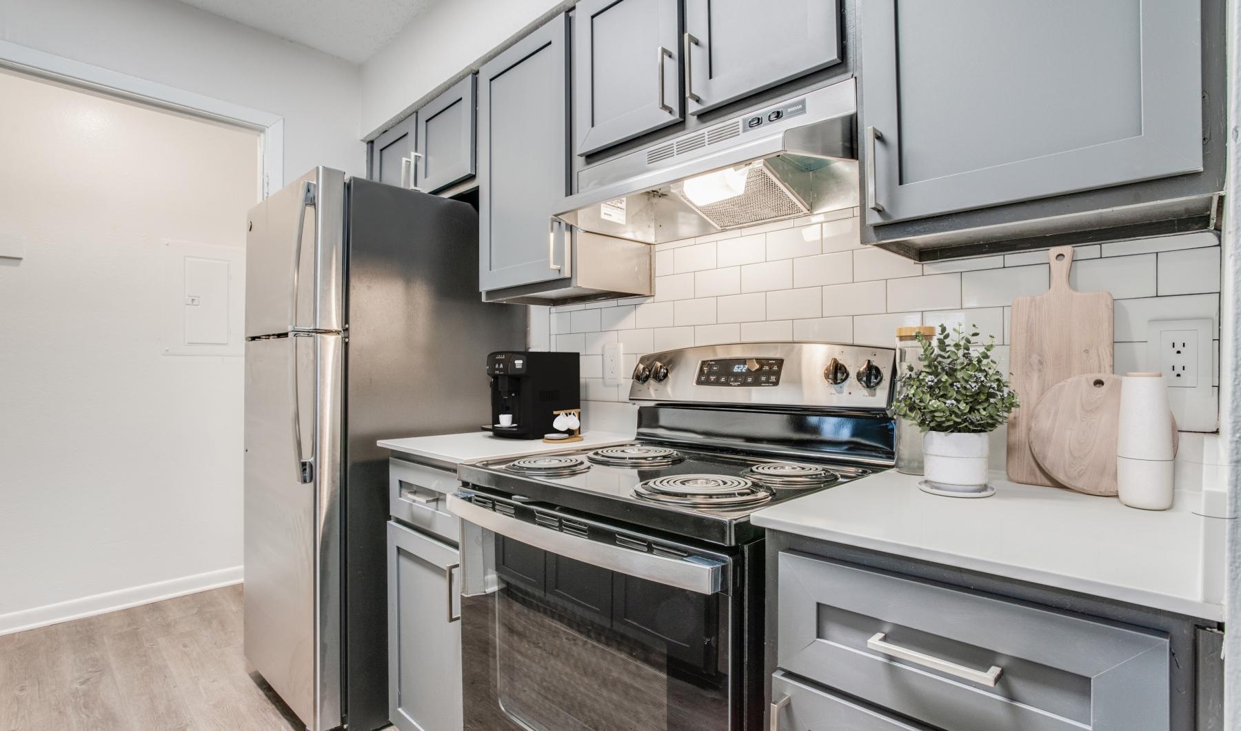 a kitchen with white cabinets