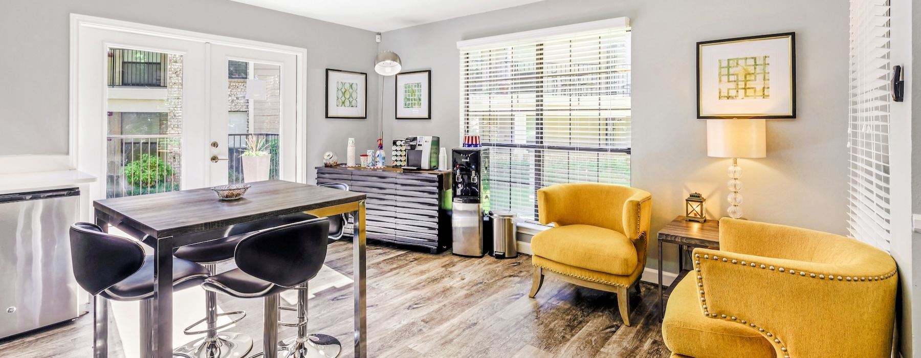 a dining room with a table and chairs