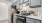 a kitchen with white cabinets