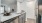 a kitchen with a sink and refrigerator