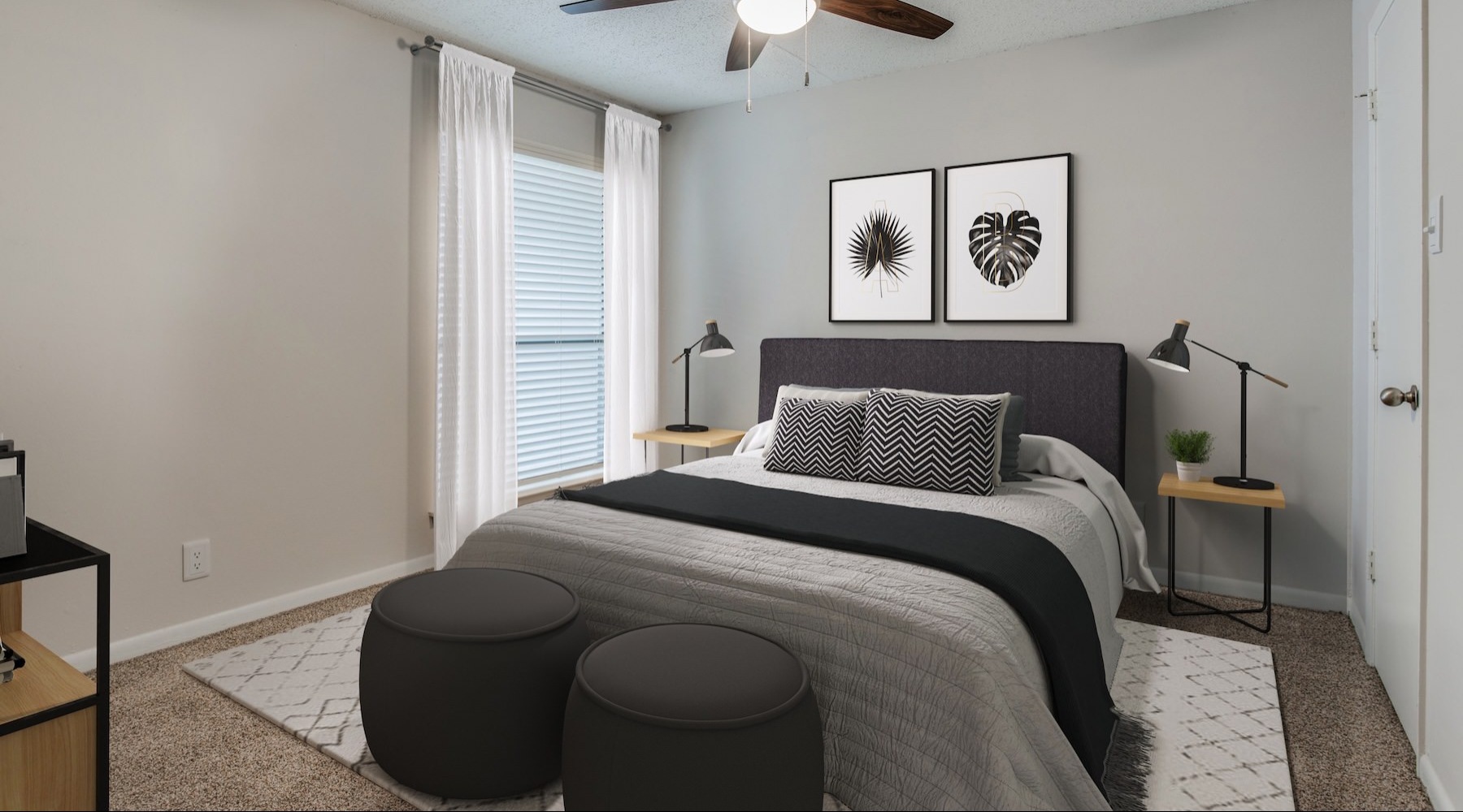 a bedroom with a fan and a bed