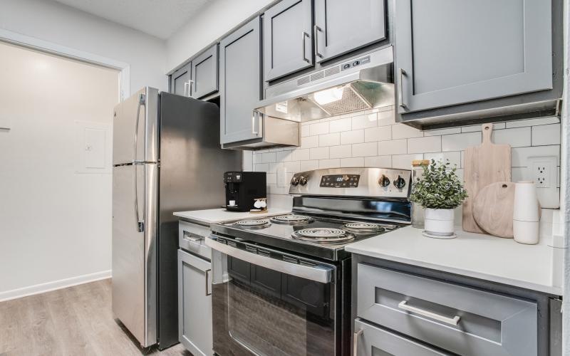 a kitchen with white cabinets